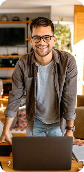 man in home office with laptop