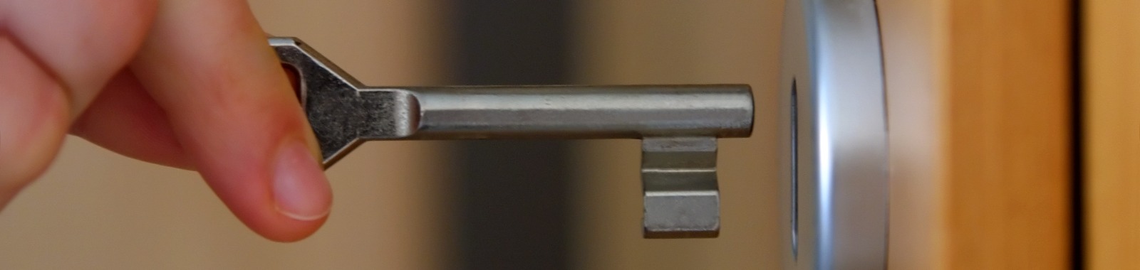 Key being inserted into door lock